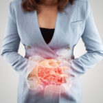 Illustration of large intestine is on the woman’s body. Business